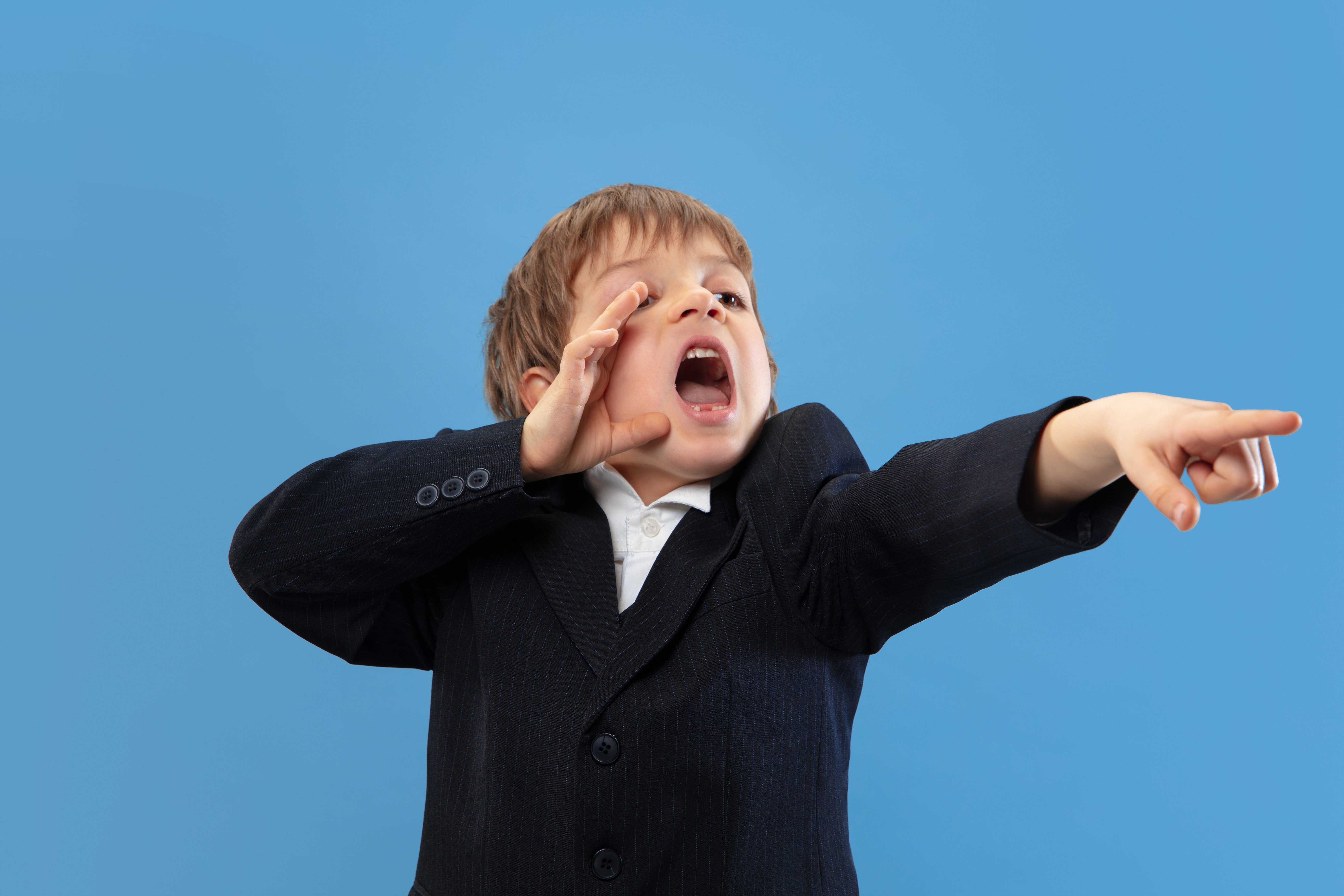 calling-shouting-portrait-young-orthodox-jewish-boy-isolated-blue-wall-purim-business-festival-holiday-childhood-celebration-pesach-passover-judaism-religion-concept (1)